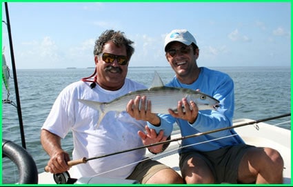 Happy customer holding a bone fish